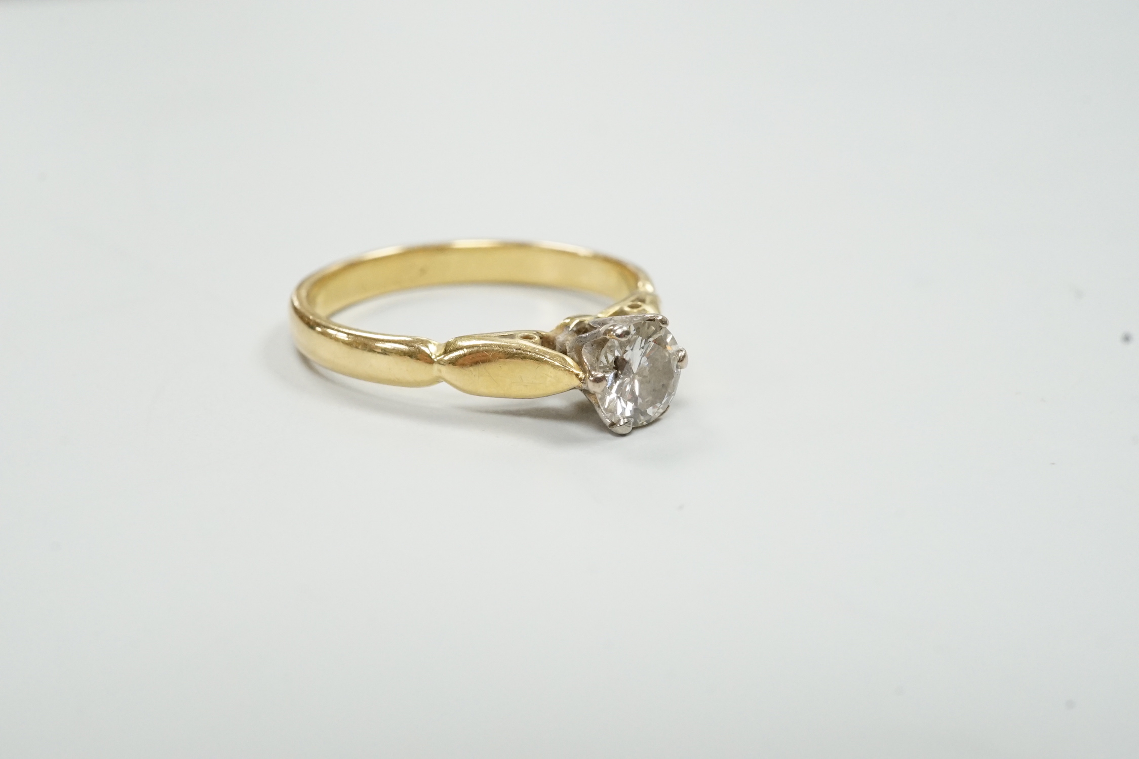 An 18ct and solitaire diamond set ring, size O, gross weight 3.6 grams.
